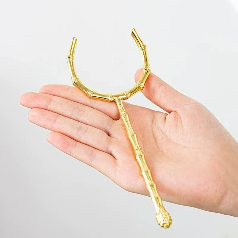 Teetassenhalter/Gabel aus goldenem Kupfer